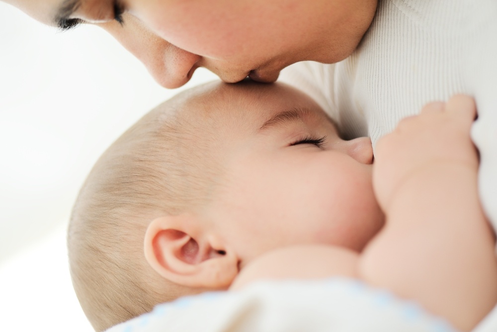 Mother caring for baby after birth.